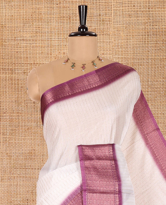 White and Purple Dola Silk Saree Embellished with Vertical Zari Stripes All Over the Body, Complemented by a Contrast Border of Traditional Zari Designs, Self-Pallu of Stripes, and Paired with a Contrast Blouse