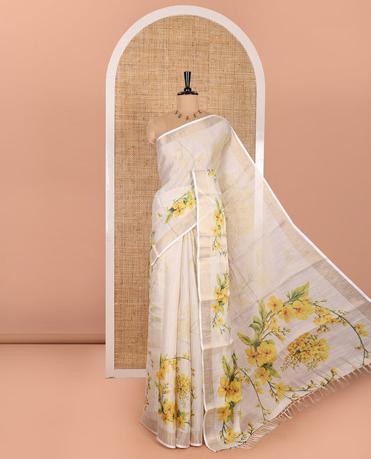 Cream Tissue Saree, Enthralled with Yellow Floral Motifs Printed All Over Its Body, Subtle Bavanji Border, Pallu Features Floral Tiara Motifs Print, and Paired with a Matching Floral Printed Blouse