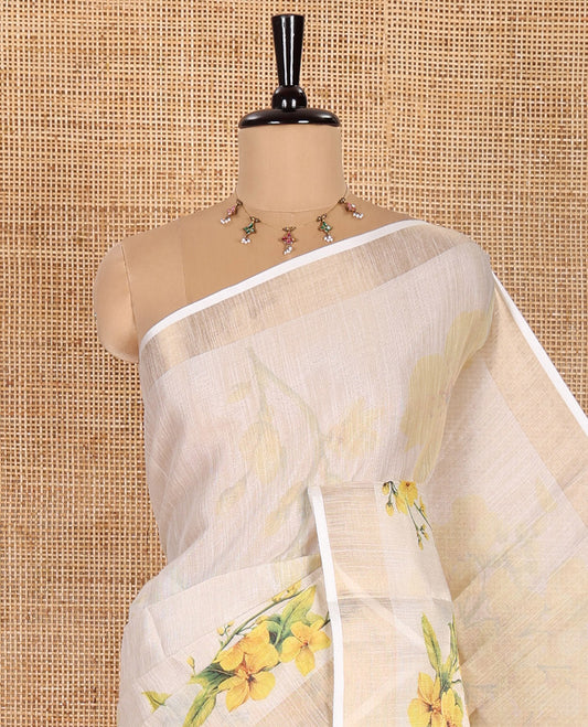 Cream Tissue Saree, Enthralled with Yellow Floral Motifs Printed All Over Its Body, Subtle Bavanji Border, Pallu Features Floral Tiara Motifs Print, and Paired with a Matching Floral Printed Blouse