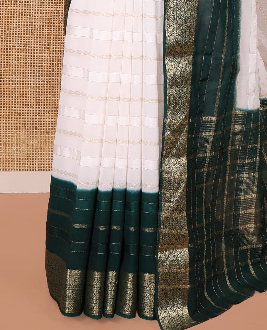 White and Green Georgette Saree, Subtly Sparkled with Horizontal Zari Stripes All Over Its Body, Complemented by a Contrast Traditional Zari Design Border, Gleaming Zari Striped Pallu, and Paired with a Contrast Blouse