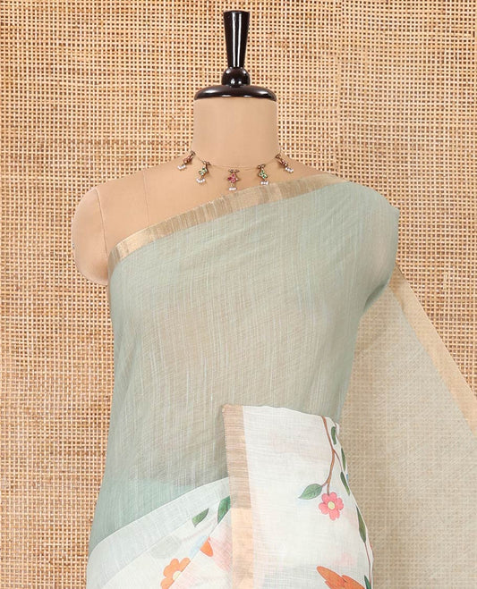 Green Linen Saree, Beautifully Decked Up with Colorful Tree and Macaw Parrot Motifs Printed on Its Body, Subtle Zari Border, Pallu of the Same Tree and Macaw Parrot Motifs Printed, and Comes with a Matching Blouse