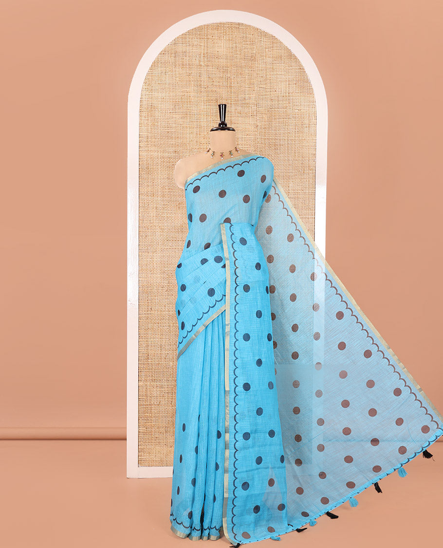 Blue Linen Cotton Saree, Beautified with Polka Dots All Over Its Body, Subtle Piping Border, Self-Pallu, and Paired with a Floral Printed Matching Blouse