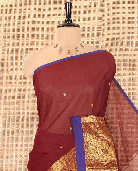 Maroon Chettinad Cotton Saree, Elevated with Thread Buttas All Over Its Body, Highlighted by Traditional Zari Border of Round Peacock Designs, Subtly Striped Pallu, and Paired with a Matching Blouse