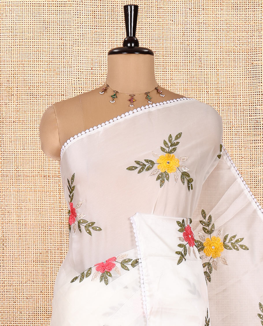 White Rangoli Chiffon Saree, Artfully Embroidered with Floral Motifs in Thread and Stone Work On Its Body, Subtly Sparkled with Lace Border, a Self-Pallu, and Paired with a Contrast Floral Embroidered Blouse