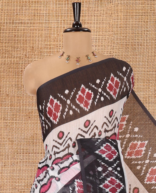 White and Black Linen Cotton Saree, Colorful Ikat Woven On Its Body, Complemented by Contrast Ikkat Geometric Border, Pallu Steeped with Buttas and Paired with a Contrast Blouse