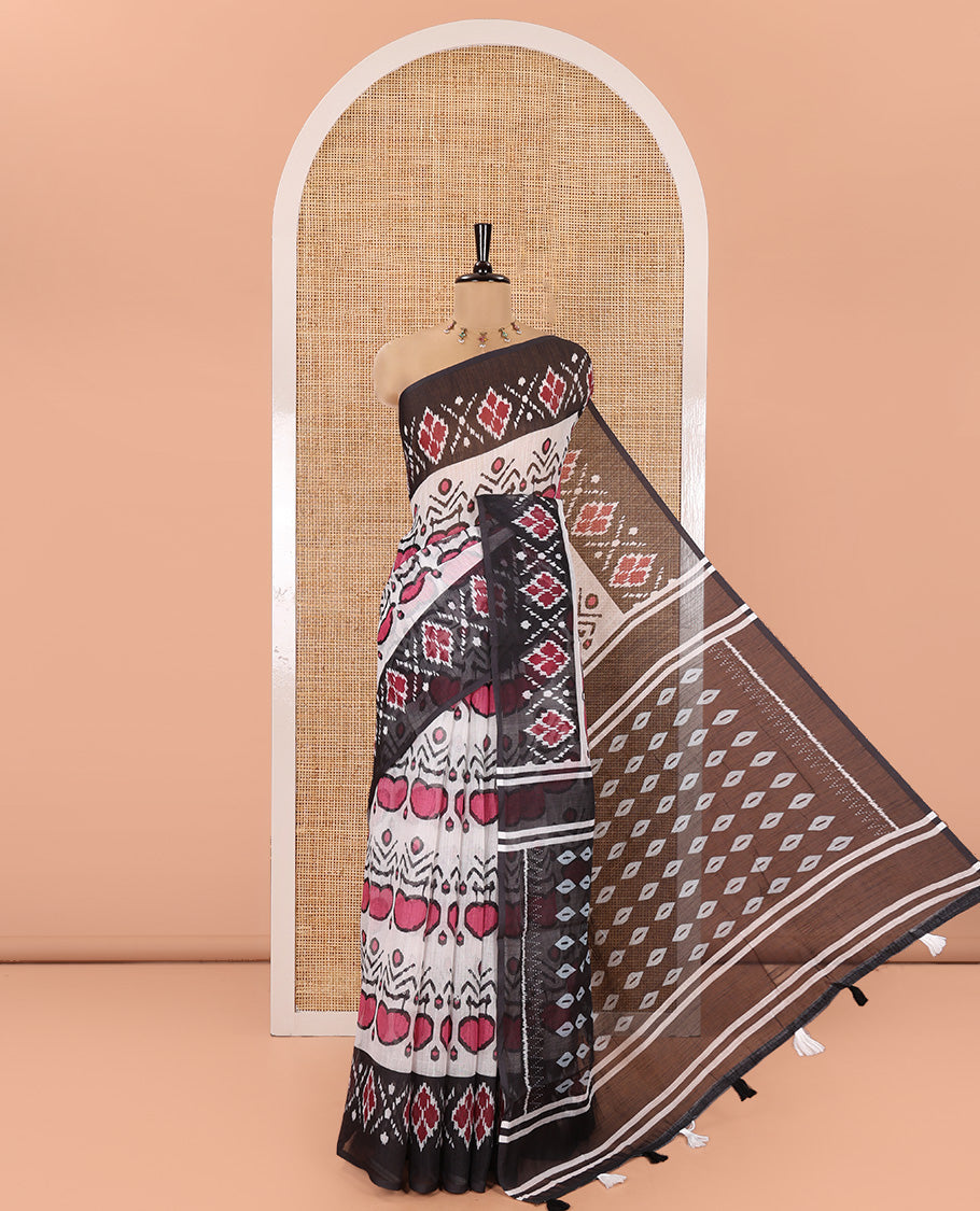 White and Black Linen Cotton Saree, Colorful Ikat Woven On Its Body, Complemented by Contrast Ikkat Geometric Border, Pallu Steeped with Buttas and Paired with a Contrast Blouse