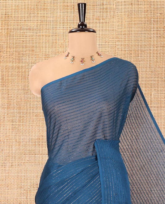 Borderless Blue Chiffon Saree, Gleamed Up with Horizontal Stripes on Its Body, a Self-Pallu, and Comes Without a Blouse