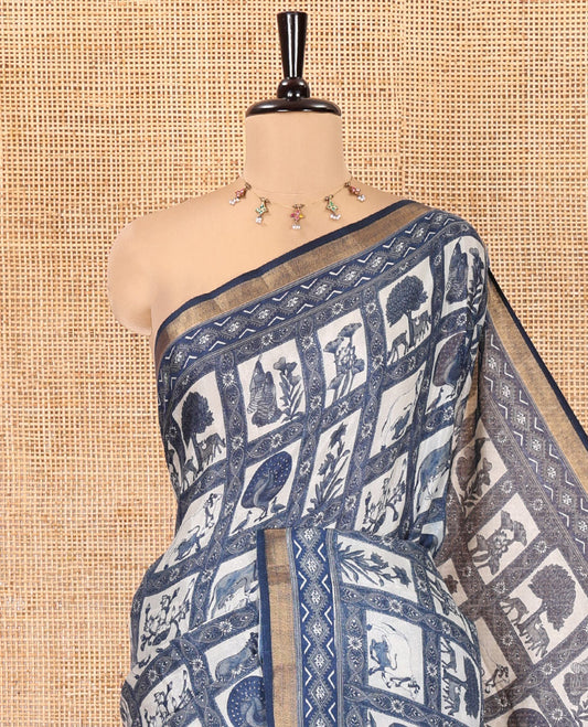 Indigo Blue Muslin Cotton Saree, Elevated with Flora-Fauna Motif Enclosed Checks on Its Body, a Subtle Zari Border, Striped Pallu, and Matching Blouse