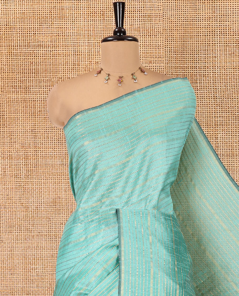 Borderless Rama Semi-Raw Silk Saree, Decked Up with Muthu Stripes on Its Body, Complemented by a Contrast Zari Striped Pallu, and Paired with a Contrast Blouse