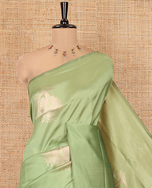 Borderless Olive Green Kanchi Silk Saree, Majestically Detailed with Zari Buttas, Intricate Pallu, and a Matching Blouse
