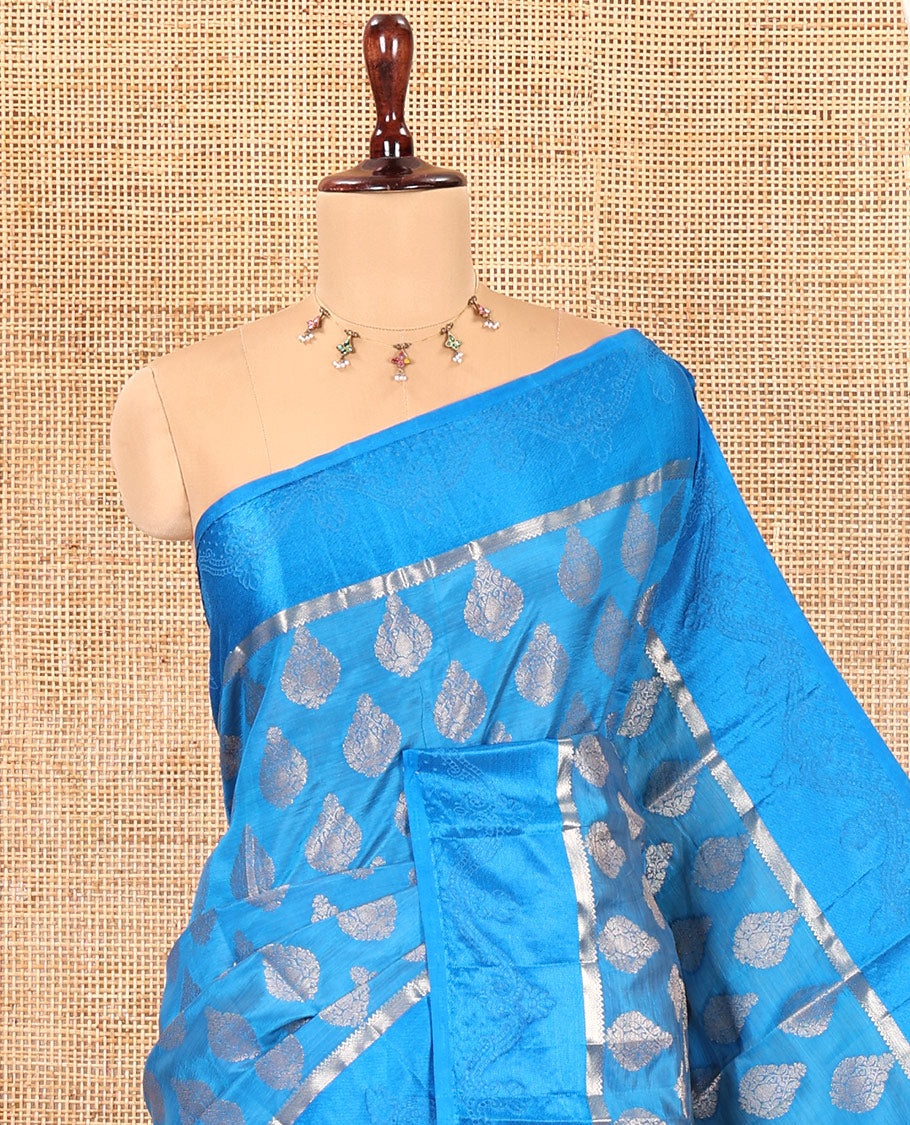 Blue Semi-Tussar Saree, Bedecked with Zari Buttas, a Satin Embossed Border, Gleaming Pallu, and a Matching Blouse
