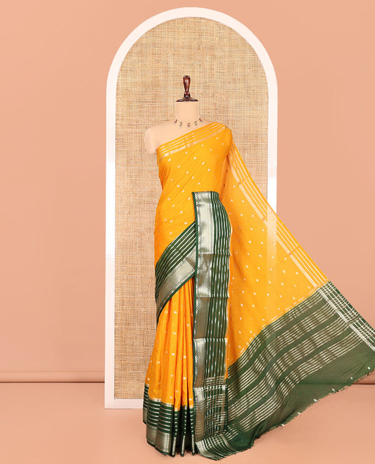 Yellow Art Crepe Saree Features Zari Buttas, Complemented by Contrast Traditional Zari Border, Zari Striped Pallu, and a Contrast Blouse