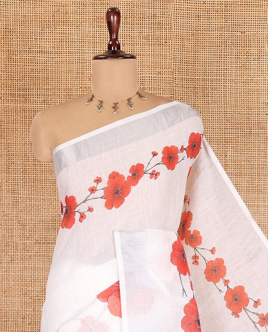 White-Red Linen Cotton Saree, Beautified with Floral Print, a Subtle Zari Border, and a Matching Blouse