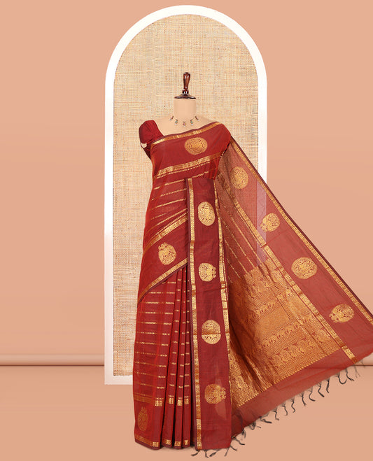 Maroon Chettinad Cotton Saree, Ornamented with Zari Stripes, a Zari Iruthalai Pakshi-Yaali Border, Grand Pallu, and a Matching Blouse