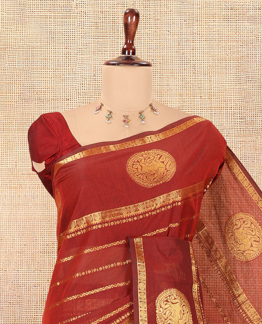 Maroon Chettinad Cotton Saree, Ornamented with Zari Stripes, a Zari Iruthalai Pakshi-Yaali Border, Grand Pallu, and a Matching Blouse