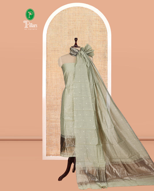 Pista Green Banarasi Chanderi Material Churidar Subtly Sparkled with Buttas Top, a Plain Bottom, and a Matching Dupatta