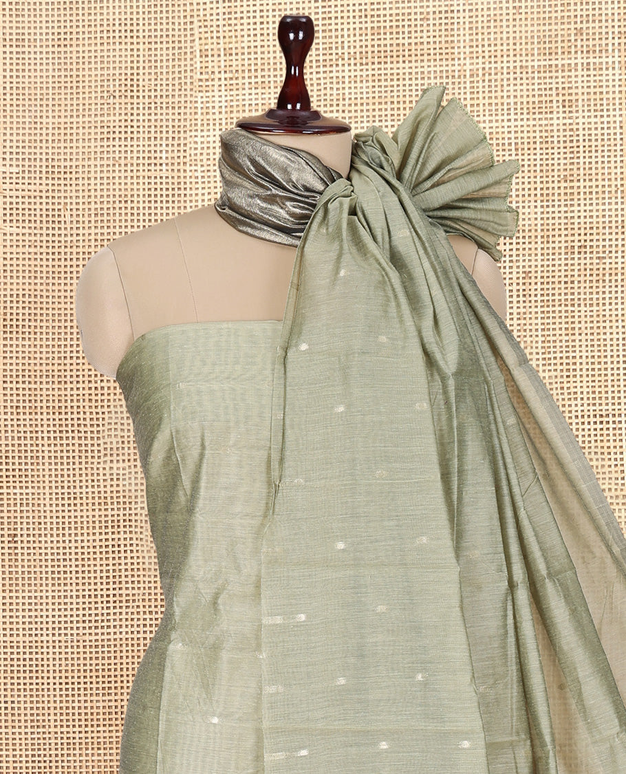 Pista Green Banarasi Chanderi Material Churidar Subtly Sparkled with Buttas Top, a Plain Bottom, and a Matching Dupatta