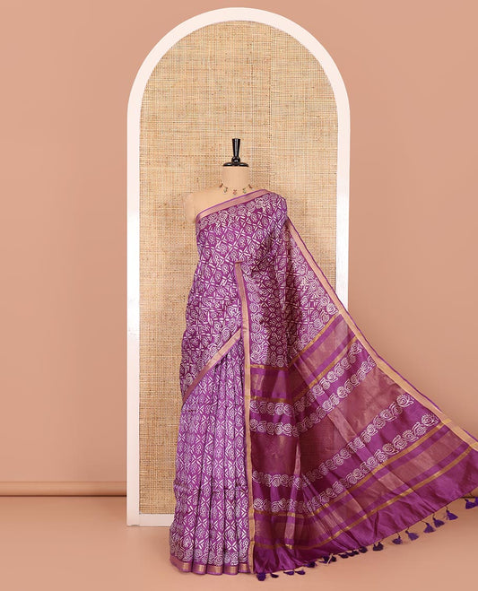 Purple intricately batik printed banana pith saree, zari piping border, floral creeper printed pallu, and a matching batik printed blouse
