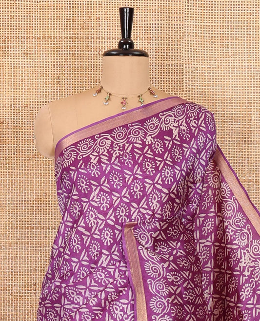 Purple intricately batik printed banana pith saree, zari piping border, floral creeper printed pallu, and a matching batik printed blouse