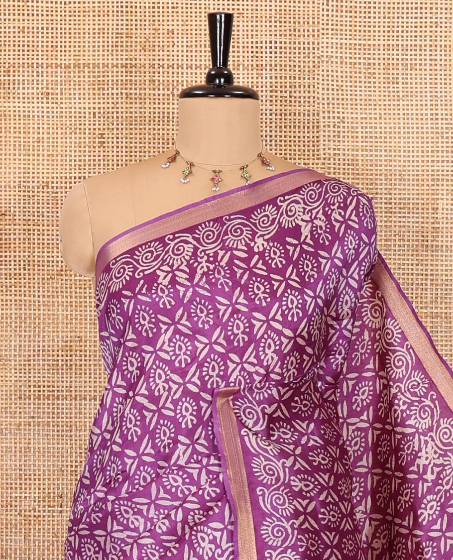 Purple intricately batik printed banana pith saree, zari piping border, floral creeper printed pallu, and a matching batik printed blouse