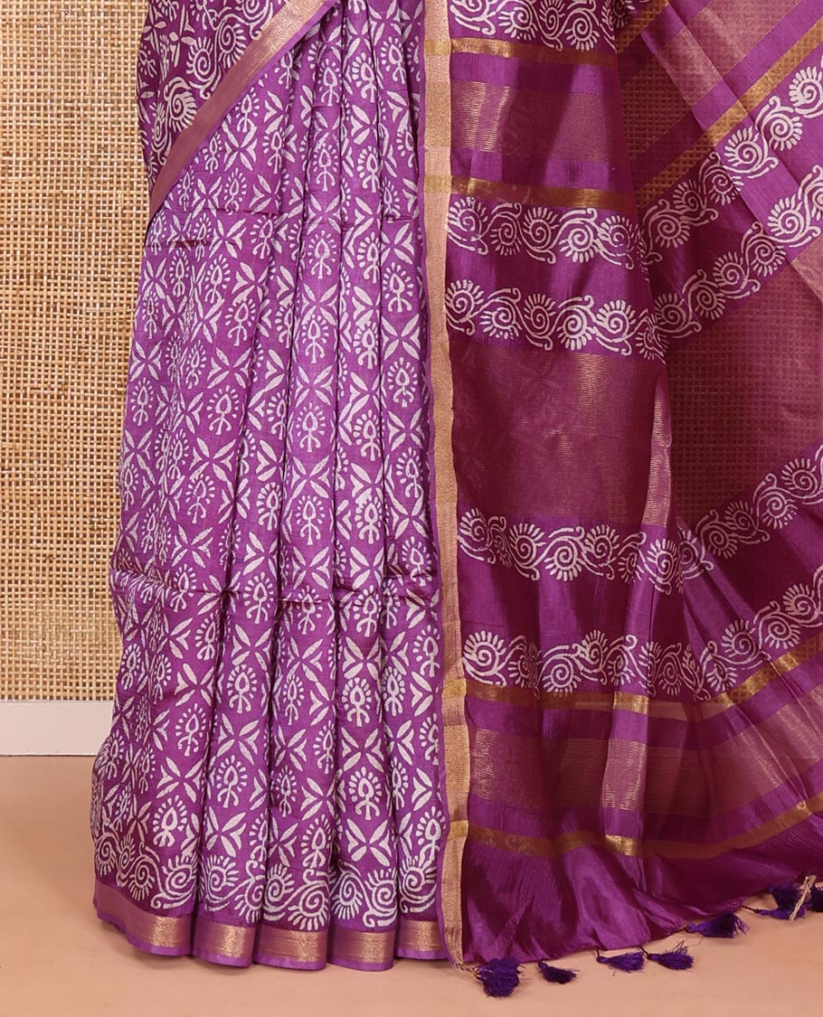 Purple intricately batik printed banana pith saree, zari piping border, floral creeper printed pallu, and a matching batik printed blouse