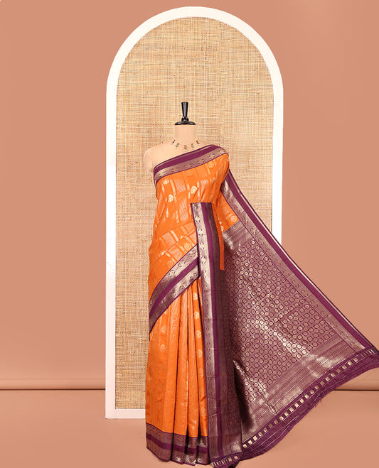 Orange Litchi Saree, Detailed with Vaira Oosi Stripes and Zari Buttas on Its Body, Complemented by a Contrast Rettai Pettu Traditional Zari Design Border, an Intricately Designed Pallu, and Paired with a Contrast Blouse