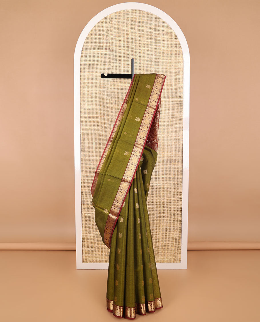 Green motifs silk cotton saree with intricate zari design border & floral design pallu