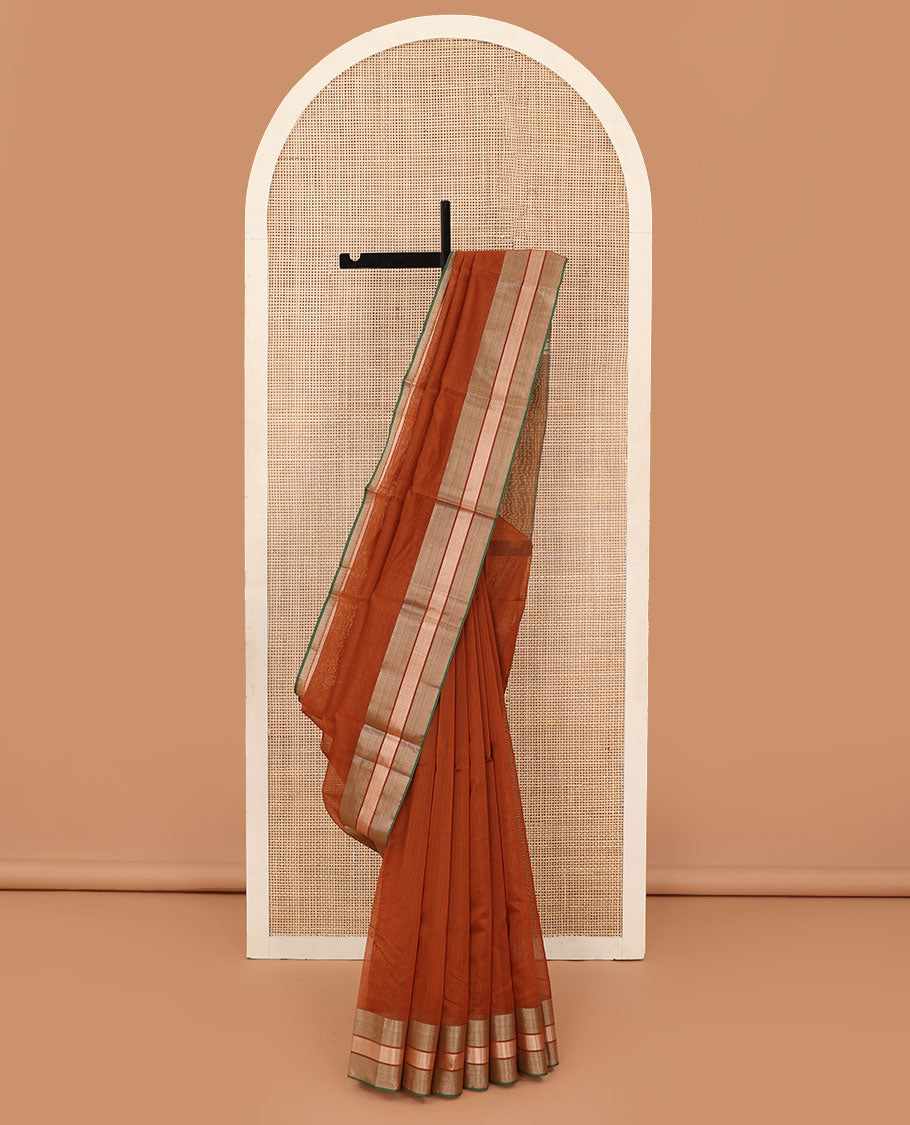 Rust plain silk cotton saree, contrast zari border, and plain pallu
