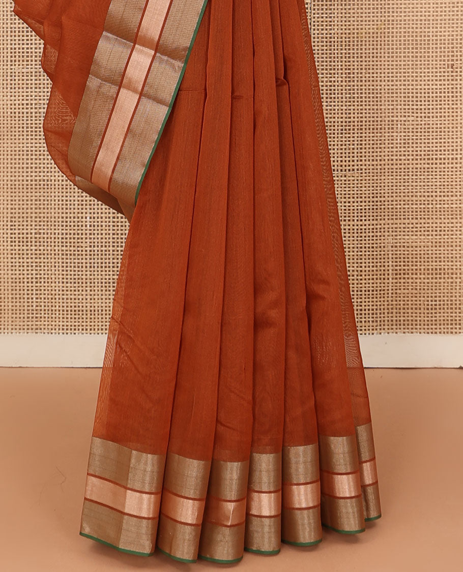 Rust plain silk cotton saree, contrast zari border, and plain pallu