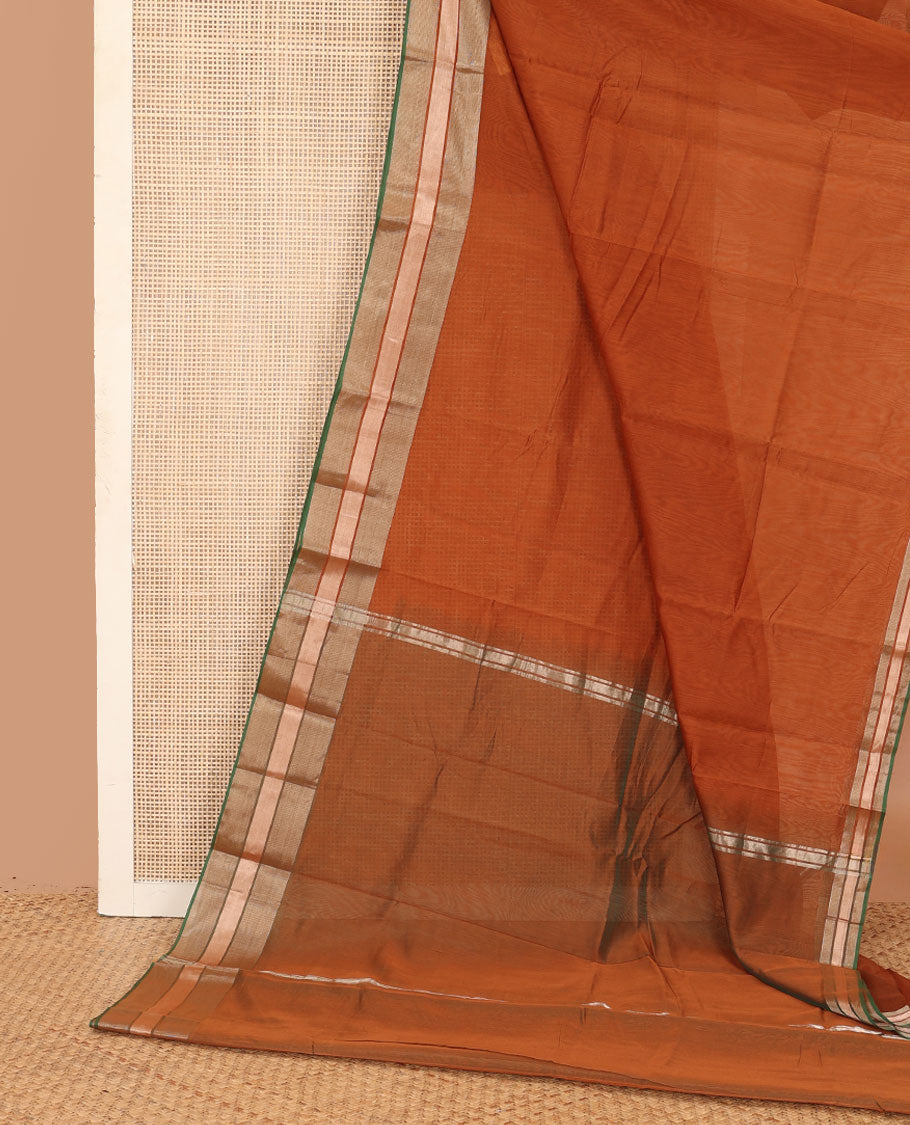 Rust plain silk cotton saree, contrast zari border, and plain pallu