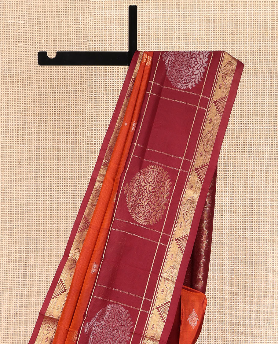 Orange Uppada Silk Saree, Mesmerized with Zari Buttas All Over Its Body, Complemented by a Contrast Traditional Border of Diamond Designs, Pallu Woven with Floral Jaal Designs, and Paired with a Contrast Blouse