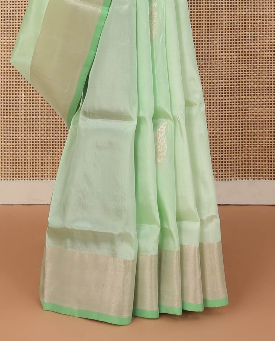 Pista green zari buttas Uppada saree, bavanji border, and contrast paisley design pallu