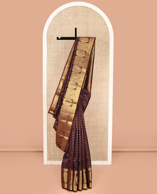 Brown Vasundhara Lite Silk Mix Saree, Adorned with Zari Buttas on Its Body, Highlighted by a Zari Border of Temple Traditional Zari Designs, Pallu Steeped with Arrow Motifs, and Paired with a Matching Blouse