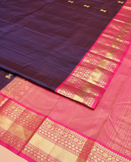 Navy Blue Vasundhara Silk Saree Adorned with Zari Buttas, Complemented by a Contrast Border of Thilakam, Diamond, Kodi Visiry, and Rudraksham Designs, Delicately Woven Pallu of Ara Maadam Designs, and a Contrast Blouse