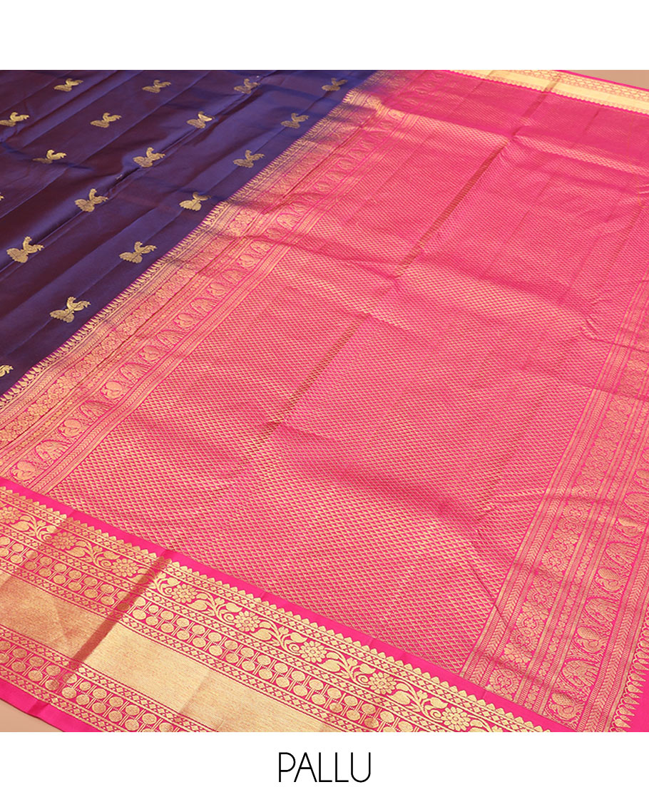 Navy Blue Vasundhara Silk Saree Adorned with Zari Buttas, Complemented by a Contrast Border of Thilakam, Diamond, Kodi Visiry, and Rudraksham Designs, Delicately Woven Pallu of Ara Maadam Designs, and a Contrast Blouse