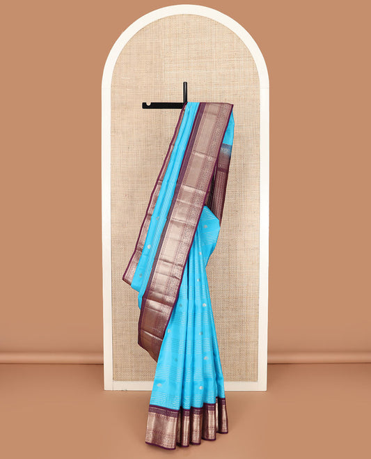 Blue zari design silk saree, contrast border of rekku, muthu, kathir, rudraksham, mayil kann, kuthirai, and yaanai designs, and geometric patterned pallu