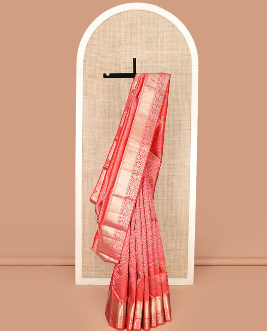 Red Kanchipuram Silk Saree Majestically Detailed with Floral Jacquard Design, Highlighted with Zari Border of Thilakam, Neli, and Floral Designs, Impeccably Designed Pallu of Floral-Geometric Designs, and Paired with a Matching Blouse