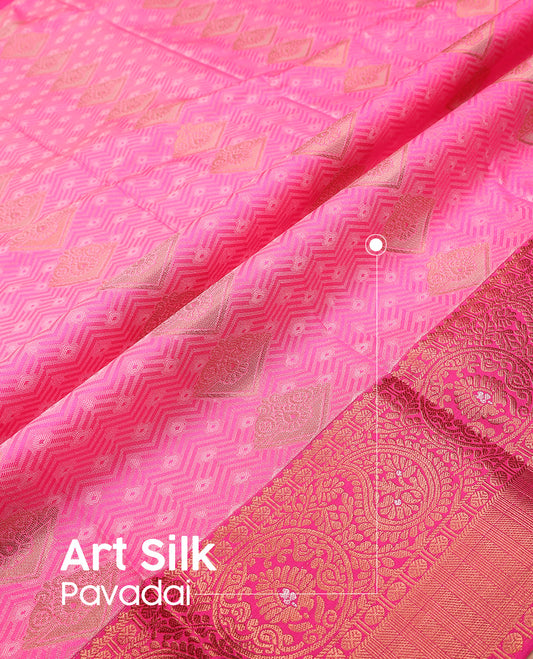 Pink art silk pavadai set, embossed, zari design with contrast traditional zari bordered skirt and a contrast zari design blouse
