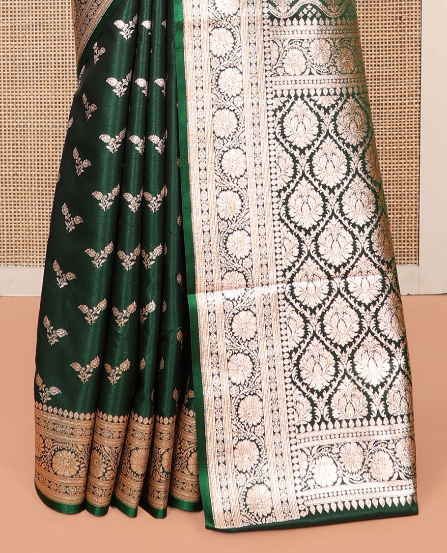 Green Banarasi Nylon Saree, Beautifully Bedecked with Buttas, a Floral Creeper Zari Border, Intricate Pallu, and a Matching Blouse