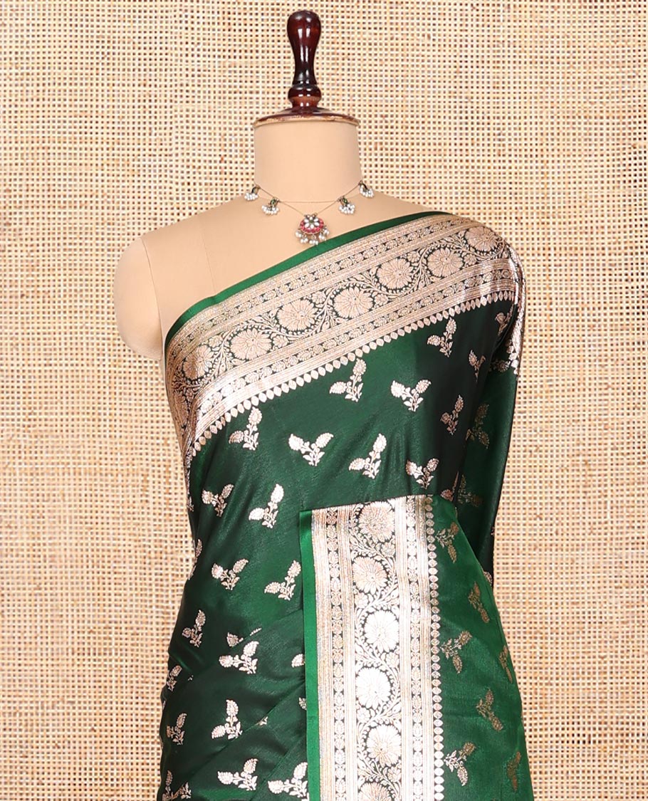 Green Banarasi Nylon Saree, Beautifully Bedecked with Buttas, a Floral Creeper Zari Border, Intricate Pallu, and a Matching Blouse