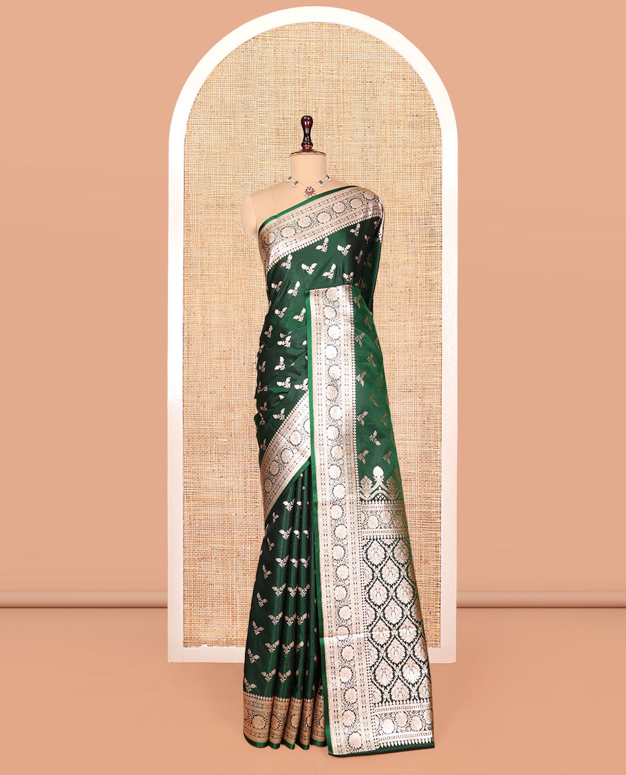 Green Banarasi Nylon Saree, Beautifully Bedecked with Buttas, a Floral Creeper Zari Border, Intricate Pallu, and a Matching Blouse