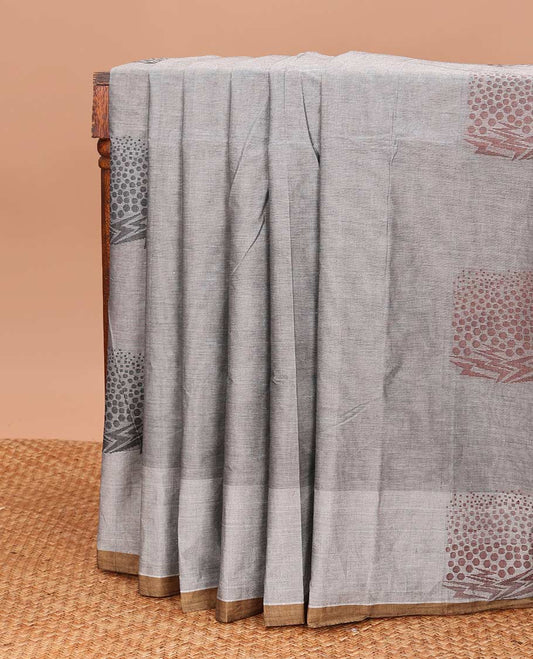 Grey unique buttas Coimbatore cotton saree, contrast unique buttas border, and pallu of geometric patterns
