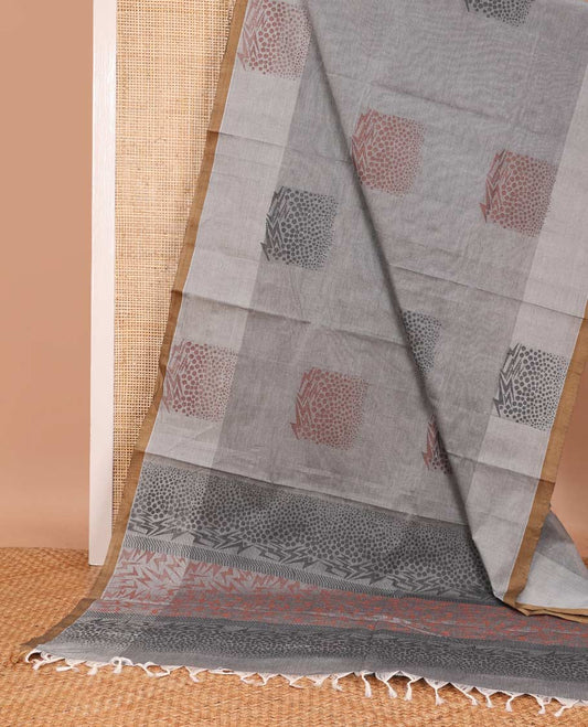 Grey unique buttas Coimbatore cotton saree, contrast unique buttas border, and pallu of geometric patterns