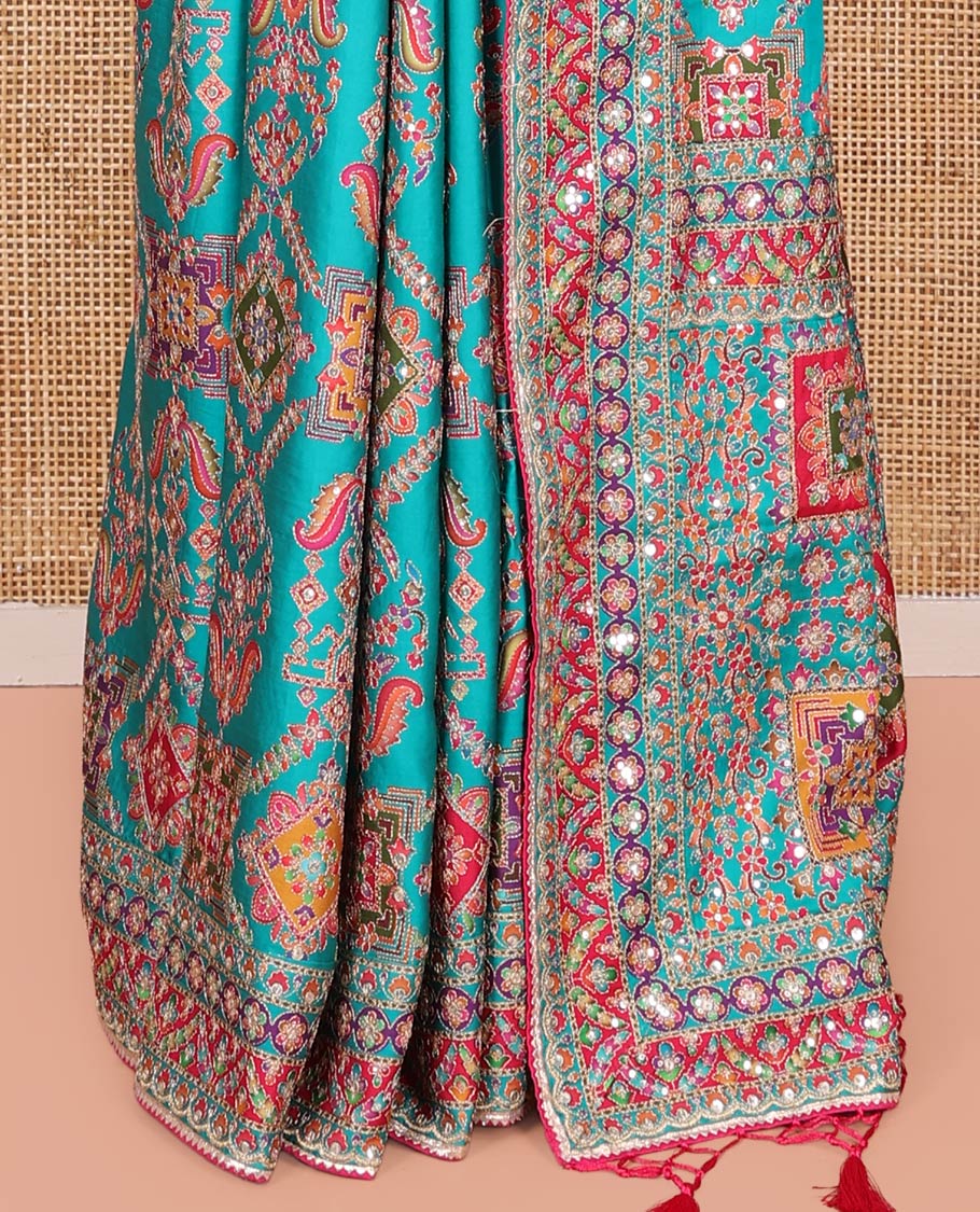 Blue Dola Silk Saree, Adorned with Intricate Designs on Its Body, Highlighted by Mughal-Style Patterns Printed Border, Intricately Designed Pallu, and Paired with a Sweet Heart Elbow Sleeve Blouse