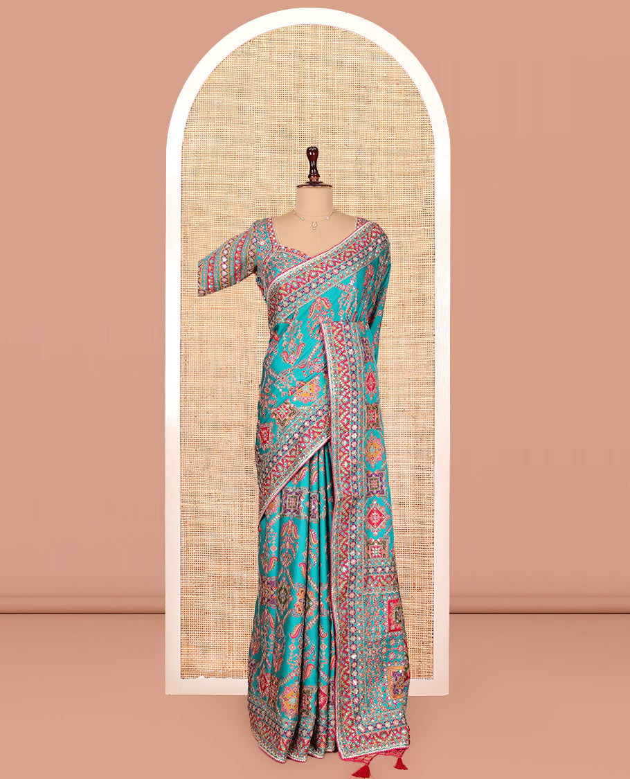 Blue Dola Silk Saree, Adorned with Intricate Designs on Its Body, Highlighted by Mughal-Style Patterns Printed Border, Intricately Designed Pallu, and Paired with a Sweet Heart Elbow Sleeve Blouse