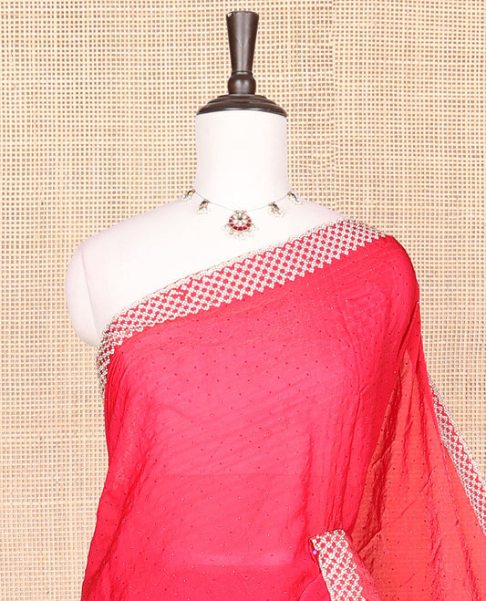 Red embroidery designer saree with stones embedded in its body, scallop stone work border