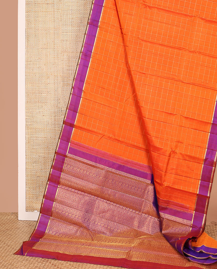 Orange zari checked Kanchipuram silk saree, contrast zari striped border, and pallu of manga kodi, laddu kamalam, and mayil designs