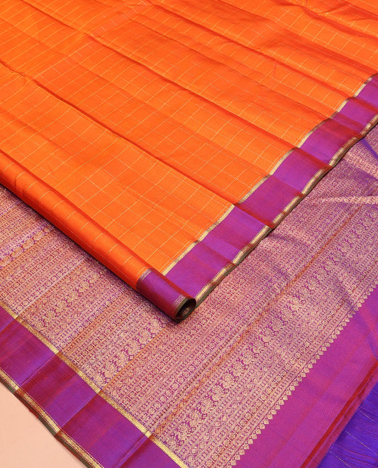 Orange zari checked Kanchipuram silk saree, contrast zari striped border, and pallu of manga kodi, laddu kamalam, and mayil designs