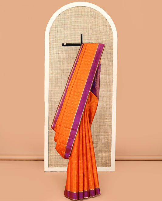 Orange zari checked Kanchipuram silk saree, contrast zari striped border, and pallu of manga kodi, laddu kamalam, and mayil designs