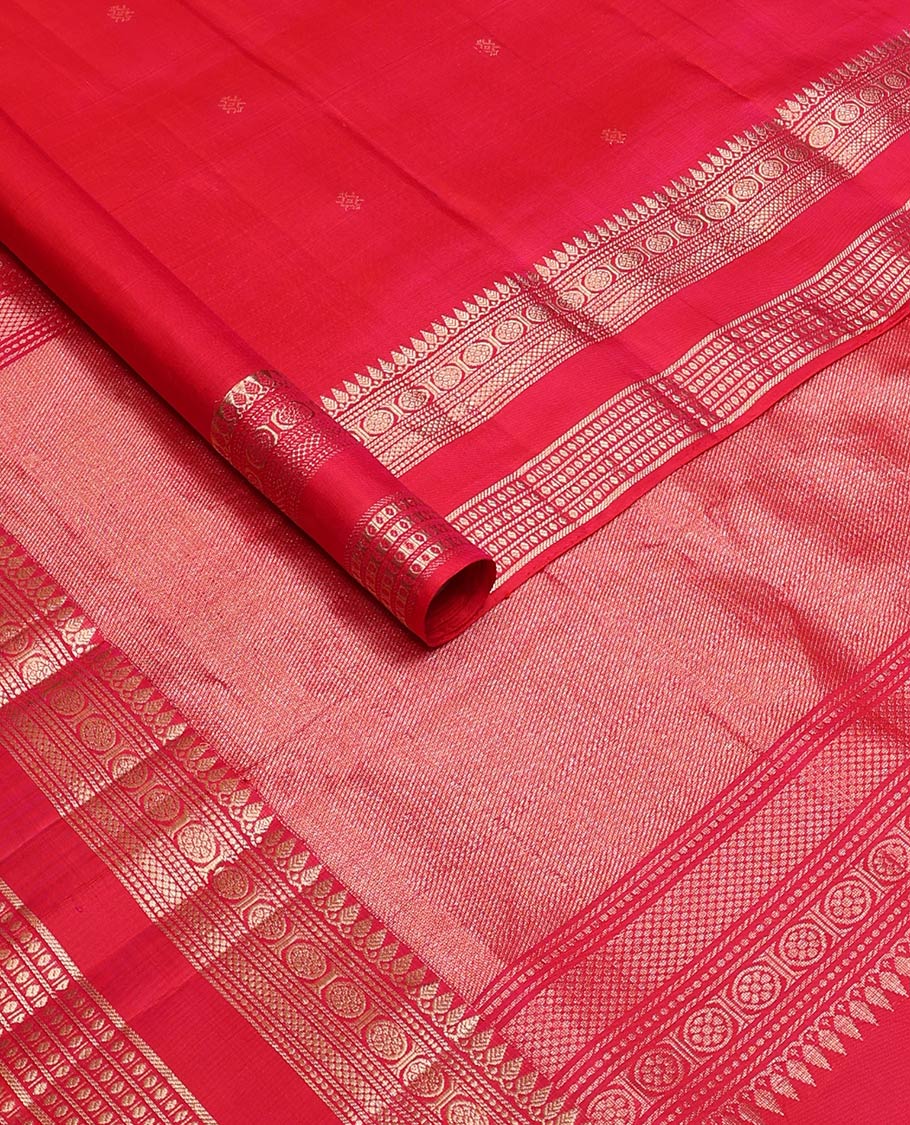 Red zari buttas soft silk saree, rettai pettu border and pallu adorned with traditional zari designs